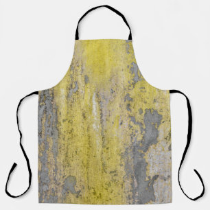 Alte graue Betonwand mit schälender gelber Farbe. Schürze