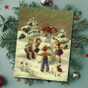Alte Kinder beim Bau eines Schneemanns Postkarte