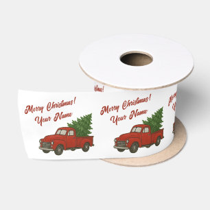 Alte rote Vintage-Pickup-Truck mit Weihnachtsbaum Satinband