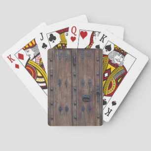 Alte spanische Holztür mit Riegeln Spielkarten