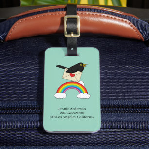 Amsel fliegt über den Regenbogen mit Brief Gepäckanhänger
