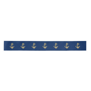 Ancre dorée sur ruban bleu marine en satin