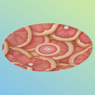 Anfänglich frisch gepicktes rosa Grapefruitmonogra Pappteller