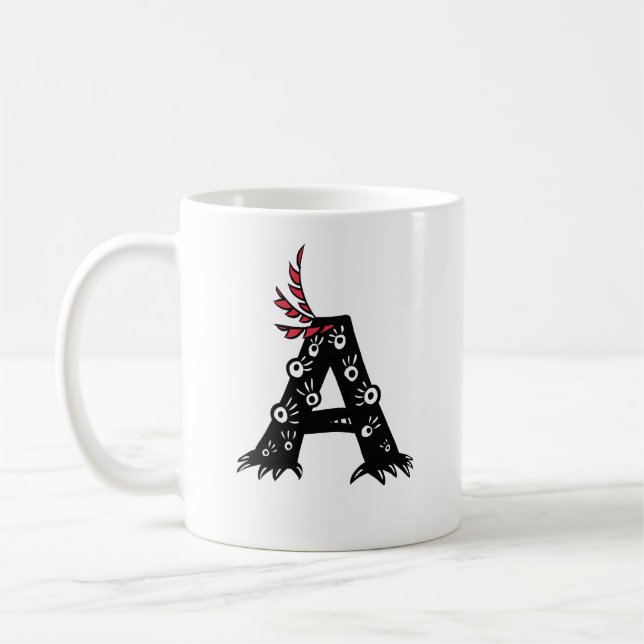 Anfangsbuchstabe ein lustiges niedliches Monster Kaffeetasse (Links)