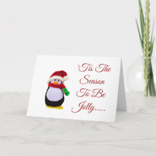 Angefüllter Spielzeug-Pinguin gekleidet für Winter Karte