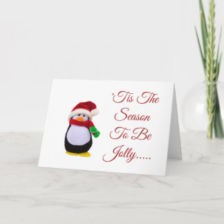 Angefüllter Spielzeug-Pinguin gekleidet für Winter Karte