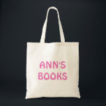 ANN'S BÜCHER in Rosa auf der Tote Tasche anpassbar<br><div class="desc">"ANN'S BOOKS" in rosa Schrift. Sie können auch den Text ändern.</div>