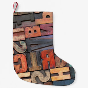 Antike Buchstabenblöcke mit Farbtinte Kleiner Weihnachtsstrumpf