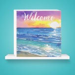 Aquareller Sonnenuntergang über dem Ozean Willkomm Holzkisten Schild<br><div class="desc">Dieses farbenfrohe Holzkastenschild ist perfekt für jeden Strandliebhaber oder jeden Zuhause. Der Begriff WELCOME kann mit dem Editierwerkzeug in Ihre gewünschte Phrase oder Nachname geändert werden.</div>
