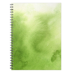 Aquarellfarben auf einem rauen notizblock