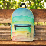 Aquarellpastellfarben Niedliches Monogramm Bedruckter Rucksack<br><div class="desc">Verlängern Sie den Tag Ihres Kindes mit dem Niedlichen Monogram-bedruckten Rucksack in Aquarellfarben, Pastellfarben und Regenbogen. Dieser bezaubernde Rucksack ist mit einem wunderschönen, pastellfarbenen Regenbogendesign mit flauschigen Wolken ausgestattet, das mit dem Monogramm Ihres Kindes für eine persönliche Touch angepasst werden kann. Es ist aus langlebigen Materialien gefertigt und verfügt über...</div>
