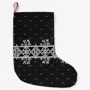 Arbeitszeile auf schwarzem Hintergrund Kleiner Weihnachtsstrumpf