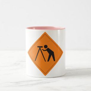 Arpenteur de terre à la tasse de rose de signe de