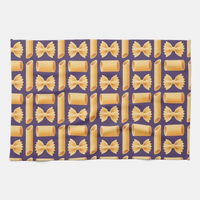 Array of various pasta shapes on a purple geschirrtuch (Horizontal)