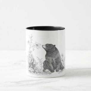 Arrêtez et sentez la tasse de fleurs