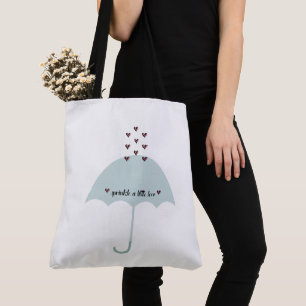 Arrosez le rose d'amour et le sac fourre-tout bleu