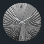 Art Deco Chrom Palmenblatt Große Wanduhr<br><div class="desc">Art-Deco-Motive basierend auf einem stilisierten Palmenblatt, in einem 3-D-Effekt in silberfarbener Farbe dargestellt</div>