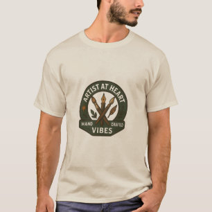 Artiste au T-shirt d'insigne artisanal de coeur