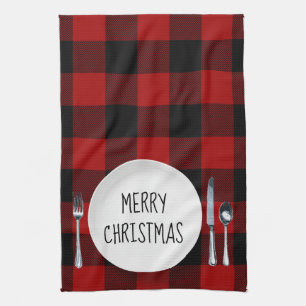 Assiette de Noël sur serviette de cuisine à carrea