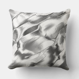 Aus mattem Metall geschnitzt, in Grautönen Kissen