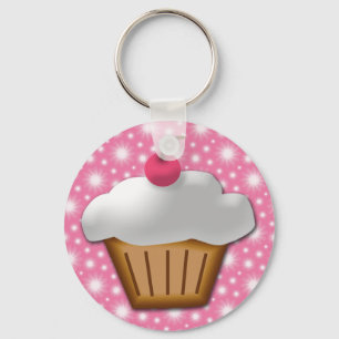 Ausschnitt-kleiner Kuchen mit rosa Kirsche auf die Schlüsselanhänger