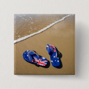 Australische Flaggen-Zapfen auf Strand Südwales Button