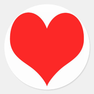 Autocollant rond avec un coeur rouge au milieu