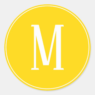 Autocollant rond blanc sur fond jaune doré avec mo