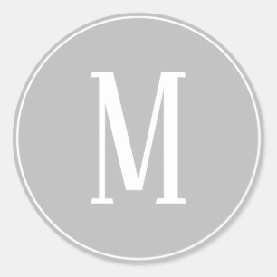 Autocollant rond blanc sur gris avec monogramme