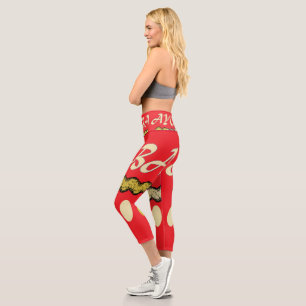 Ayoba afrikanisches Design hell rot und Senf Capri Leggings
