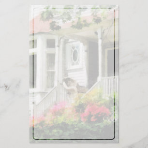 Azaleen durch Portal mit geflochtenem Stuhl Briefpapier