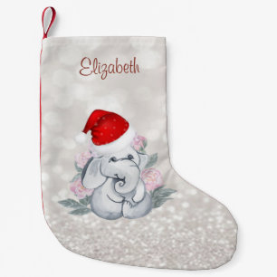 Baby-Elefant mit Weihnachtsmannmütze, Blumen, Boke Kleiner Weihnachtsstrumpf