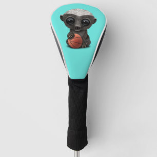 Baby-Honig-Dachs, der mit Basketball spielt Golf Headcover