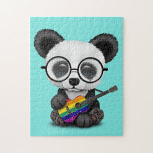 Baby-Panda, der Regenbogen-Flaggen-Gitarre spielt