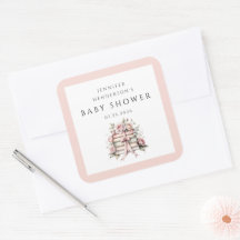 Baby-Shower mit rosa Schleife und Bücherstapel