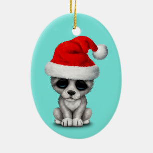 Baby-Wolf CUB, das eine Weihnachtsmannmütze träg Keramik Ornament