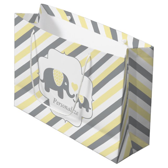 Babydusche mit weißen, gelben und grauen Streifen Große Geschenktüte (Vorderseite Schrägansicht)