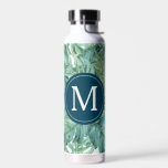 Back To School Custom Tropical Leaves Trinkflasche<br><div class="desc">These insulated water bottles feature tropical leaves in shades of green. Use the template fields to add your custom monogram. A fun choice for back to school. To see the complete line of dorm room essentials visit www.zazzle.com/dotellabelle

Watercolor art and design by Victoria Grigaliunas from Do Tell A Belle</div>