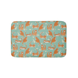 Bad Orange Tabby Katzen klopfen über Muster Badematte