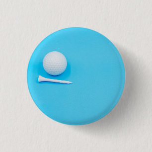 Badge Rond 2,50 Cm Golf ball et tee on blue arrière - plan
