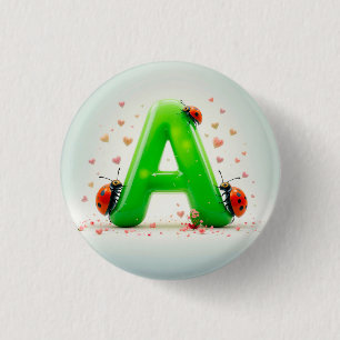 Badge Rond 2,50 Cm Jolies coccinelles sur la lettre verte de l'alphab