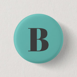 BADGE ROND 2,50 CM LETTRE INITIALE TURQUOISE CLAIRE UNIQUE