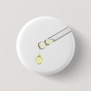 Badge Rond 2,50 Cm Sérum jaune déversé d'une pipette