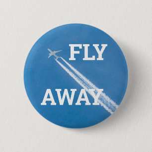 Badge Rond 5 Cm L'avion vole dans le ciel bleu