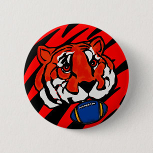 BADGE ROND 5 CM RAYURES ORANGE ET NOIRE 