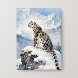 Badge Un léopard des neiges sur un pic enneigé