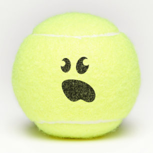 Balle de tennis jaune drôle avec le visage mignon