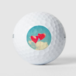 Balles De Golf Ballons du Coeur Rouge contre ciel nuageux