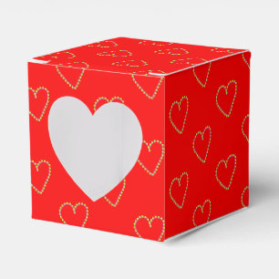 Ballotins Coeurs en forme de coeur sur rouge