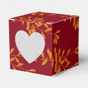 Ballotins Feuilles de branches de silhouette orange sur roug